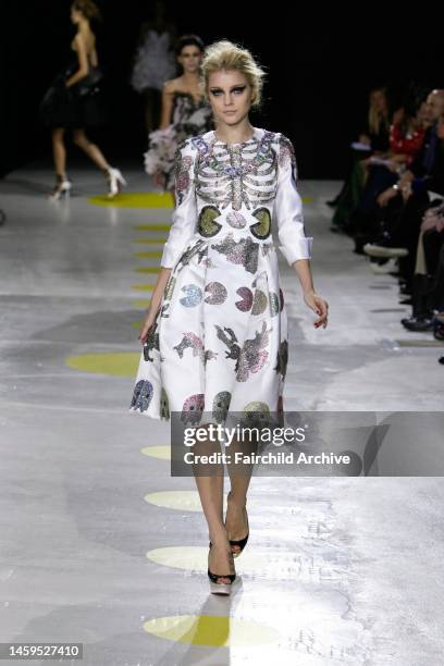 Model on the runway at Giles' spring 2009 show in London. Designer Giles Deacon referenced Pac-Man for his spring 2009 Giles collection.