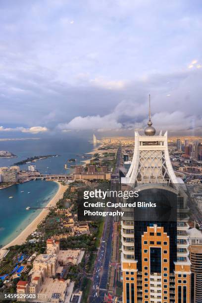 aerial view of burj al arab luxury hotel and dubai marina skyline - hotel madinat jumeirah fotografías e imágenes de stock