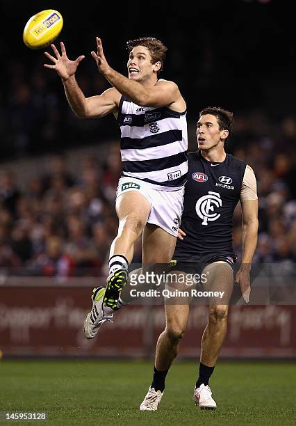 Tom Hawkins of the Cats marks during the round 11 AFL match between the Carlton Blues and the Geelong Cats at Etihad Stadium on June 8, 2012 in...