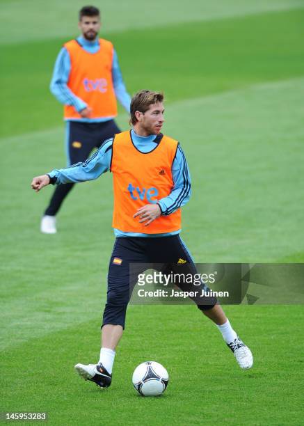 Sergio Ramos of Spain controls the ball backdropped by Gerard Pique during a training session ahead of UEFA EURO 2012 on June 8, 2012 in Gniewino,...