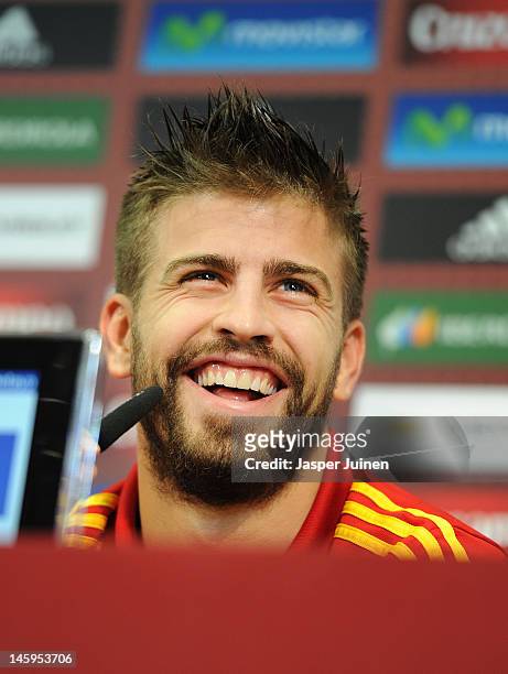 Gerard Pique of Spain laughs during a press conference after his training session with the Spanish team ahead of UEFA EURO 2012 on June 8, 2012 in...