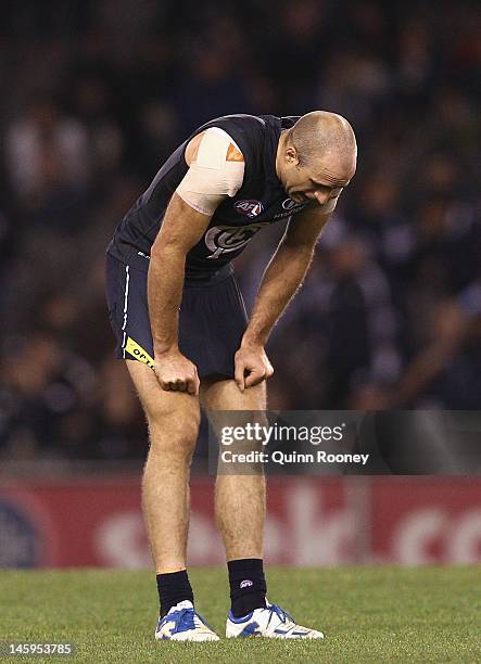 Chris Judd of the Blues looks dejected after losing the round 11 AFL match between the Carlton Blues and the Geelong Cats at Etihad Stadium on June...