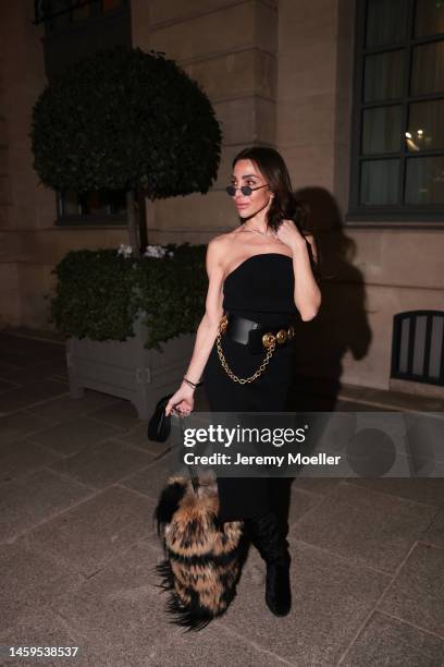 Marina Theodoridou seen wearing dress Khaite, bag Quentin Veron, belt Schiaparelli, jewellery Loree Rodkin, boots Stuart Weitzman during Paris...