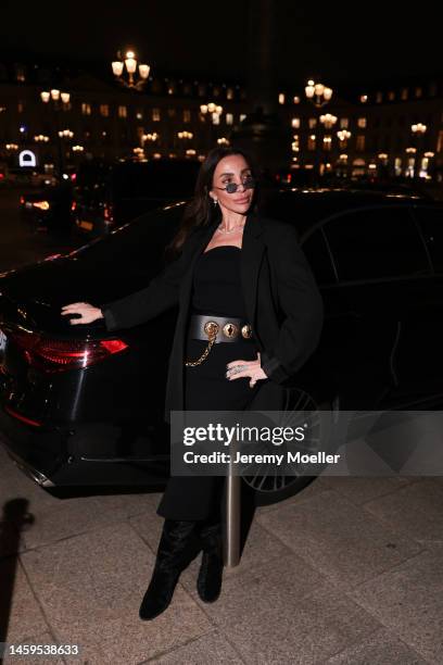 Marina Theodoridou seen wearing dress Khaite, belt Schiaparelli, jacket Alaia, jewellery Loree Rodkin, boots Stuart Weitzman during Paris Fashion...