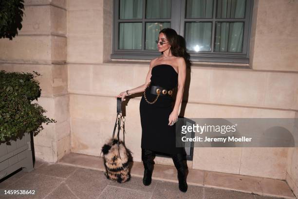 Marina Theodoridou seen wearing dress Khaite, bag Quentin Veron, belt Schiaparelli, jewellery Loree Rodkin, boots Stuart Weitzman during Paris...