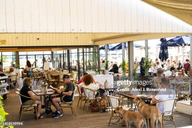 People eat at a beach restaurant on Australia Day on January 26, 2023 in Melbourne, Australia. Australia Day, formerly known as Foundation Day, is...