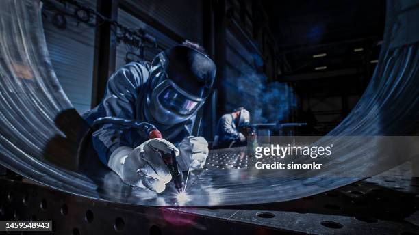 welder working in factory - sheet metal stock pictures, royalty-free photos & images