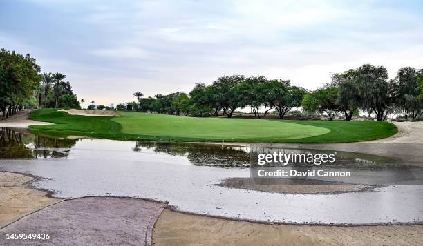 View of a flood on the third hole as heavy overnight rain causes a delay in the start of play during Day One of the Hero Dubai Desert Classic at...