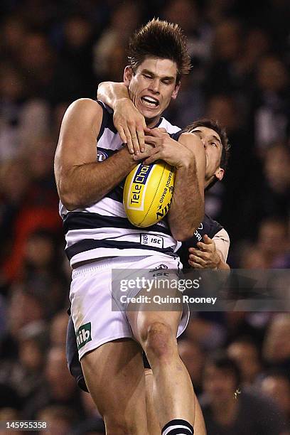 Tom Hawkins of the Cats marks during the round 11 AFL match between the Carlton Blues and the Geelong Cats at Etihad Stadium on June 8, 2012 in...