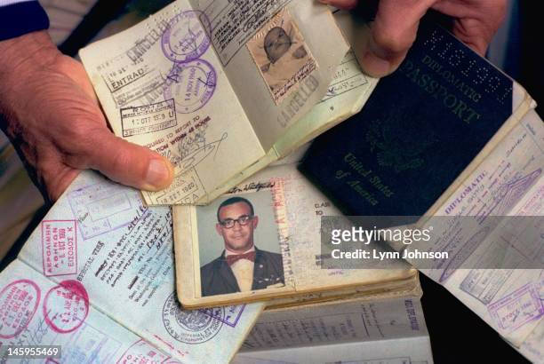 Closeup of seven passports belonging to former Olympic runner Mal Whitfield. Whitfield won three Olympic gold medals as a runner, flew in World War...