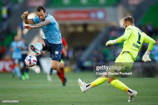 Victory goalkeeper Matthew Acton kicks the ball away from Adam Le Fondre of Sydney FC during the round 14 A-League Men's match between Melbourne...