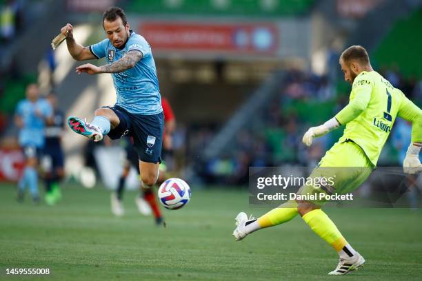 Victory goalkeeper Matthew Acton kicks the ball away from Adam Le Fondre of Sydney FC during the round 14 A-League Men's match between Melbourne...