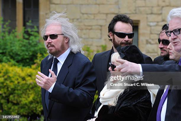 Barry Gibb and Robin's widow Dwina Murphy Gibb arrive for Robin Gibb's funeral at Priest End, Thame on June 8, 2012 in Oxford, England.