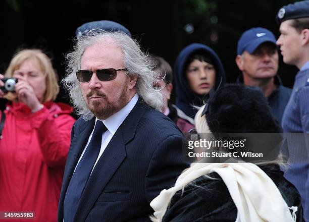 Barry Gibb and Robin's widow Dwina Murphy Gibb arrive for Robin Gibb's funeral at Priest End, Thame on June 8, 2012 in Oxford, England.