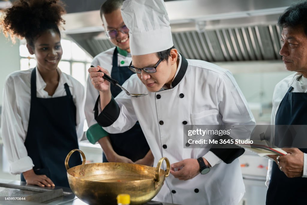 Trained Cook Chef Teaches Students Training In Cooking In A Restaurant High-Res ...