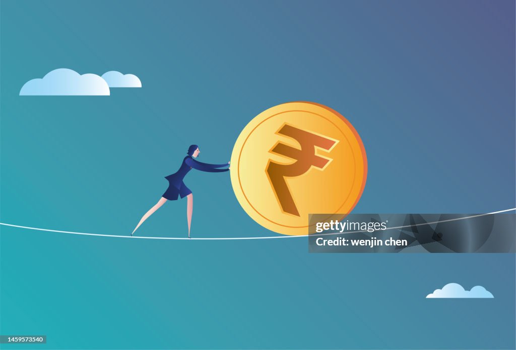 Business woman rolling Indian rupee on wire rope
