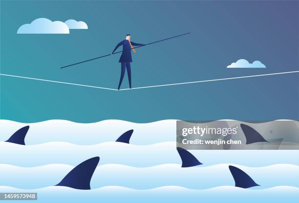 business man walking on a wire rope with a shark - tightrope stock illustrations