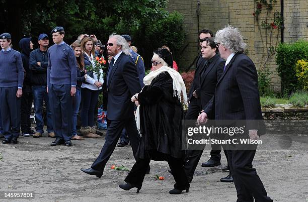 Barry Gibb, Robin's widow Dwina Murphy Gibb and Robin's son Robin-John Gibb arrive for Robin Gibb's funeral at Priest End, Thame on June 8, 2012 in...