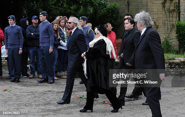 Barry Gibb, Robin's widow Dwina Murphy Gibb and Robin's son Robin-John Gibb arrive for Robin Gibb's funeral at Priest End, Thame on June 8, 2012 in...