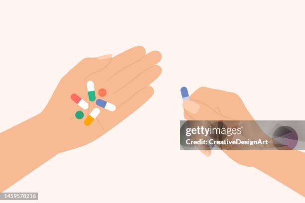 human hand holding medical drug, pills, vitamins and capsules. medication and healthcare concept - holding tablet stock illustrations