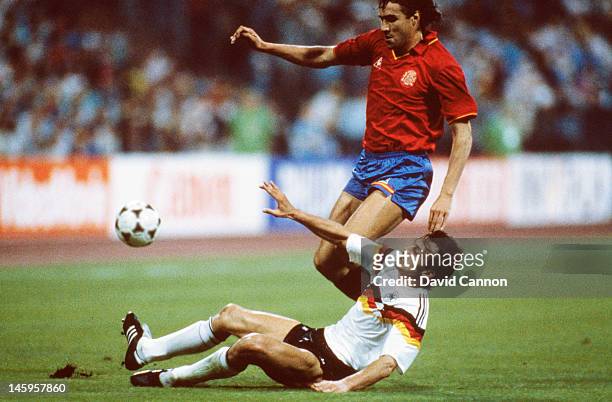 Julio Salinas of Spain is tackled by Jurgen Kohler of West Germany during the UEFA European Championships 1988 Group 1 match between West Germany and...