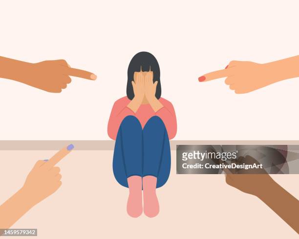 depressed woman surrounded by hands with index fingers pointing at her. sad woman covering her face with her hands. victim blaming and social judgement concept - domestic violence stock illustrations
