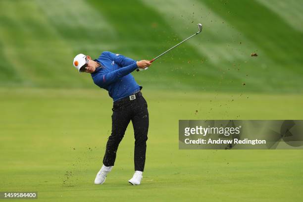 Jazz Janewattananond of Thailand plays their second shot on the 1st hole during Day One of the Hero Dubai Desert Classic at Emirates Golf Club on...