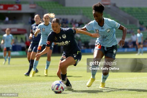 Jessika Nash of Melbourne Victory and Princess Ibini-Isei of Sydney FC compete for the ball during the round 12 A-League Women's match between...