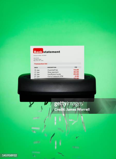 bank statement being shredded - fees concept stock-fotos und bilder