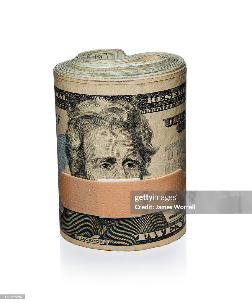 Roll of cash with Band-Aid