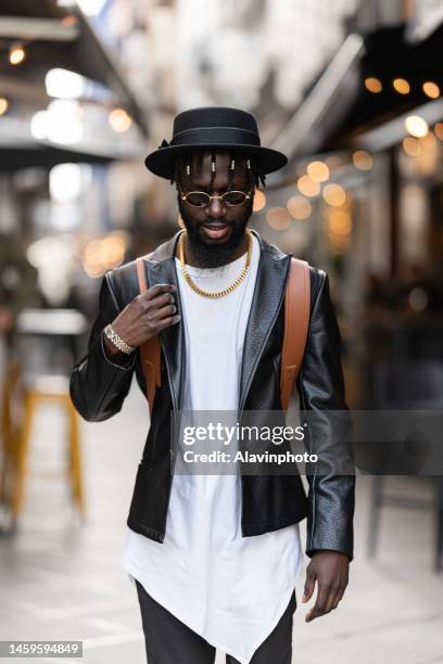 portrait of black man on a city street - vestimenta informal ストックフォトと画像