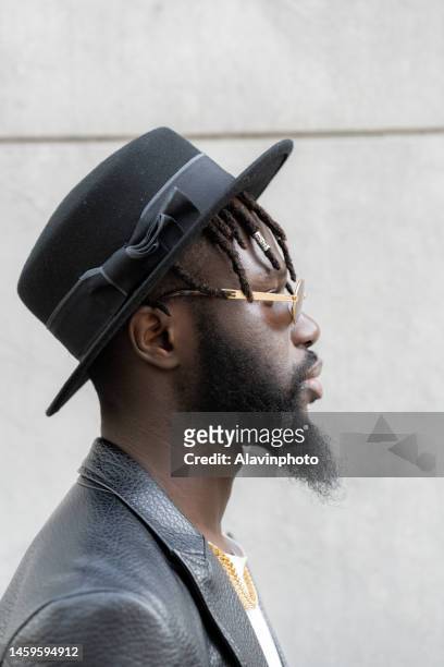 portrait of black man on a city street - vestimenta informal stock pictures, royalty-free photos & images