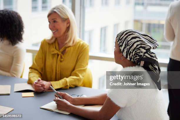 business people having meeting in office - five people stock pictures, royalty-free photos & images