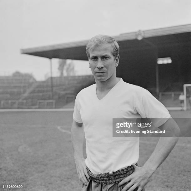 English footballer Bobby Charlton, a midfielder with Manchester United football club, training with the England national squad at Highbury stadium in...
