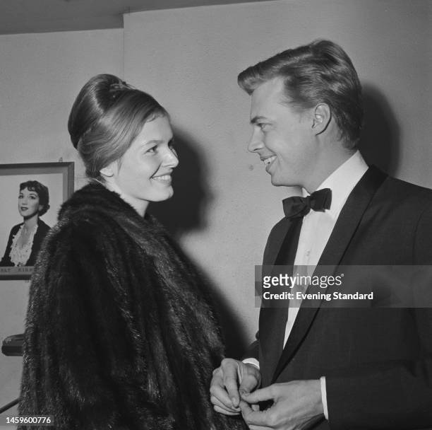 German actor Karlheinz Böhm and wife Gudula Blau attending an event on October 31st, 1959.