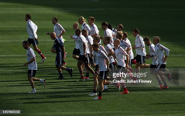 The Denmark squad warm up during Denmark Training session ahead of UEFA EURO 2012 at the Metalist Stadium on June 8, 2012 in Kharkov, Ukraine.