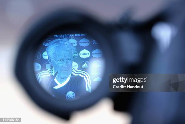 In this handout image provided by UEFA, Coach Morten Olsen of Denmark is viewed through a lens during a press conference ahead of their UEFA EURO...