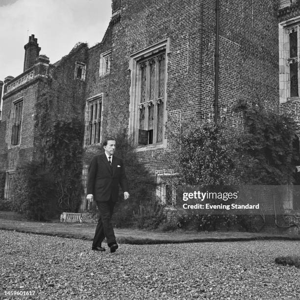 Billionaire industrialist J Paul Getty walking in the grounds of his Sutton Place estate near Guildford in Surrey, which he has just purchased from...