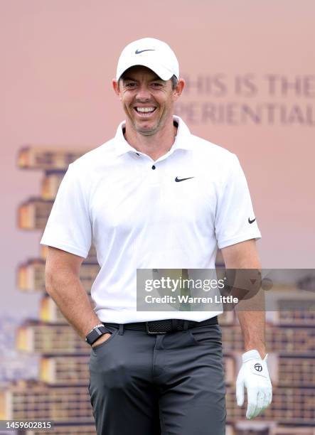 Rory McIlroy of Northern Ireland laughs on the 11th tee during Day One of the Hero Dubai Desert Classic at Emirates Golf Club on January 26, 2023 in...