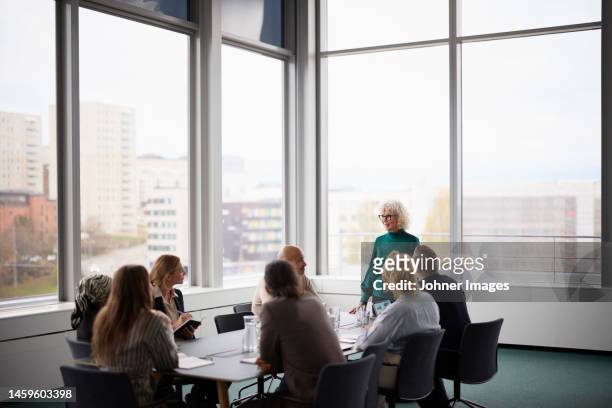 people talking during business meeting - boardroom meeting stock pictures, royalty-free photos & images