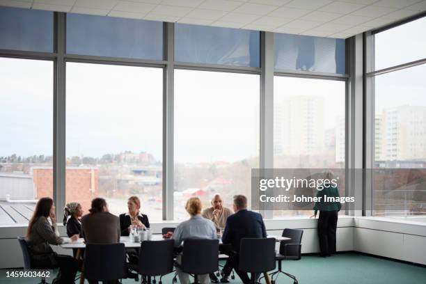 people talking during business meeting - governing board stock pictures, royalty-free photos & images