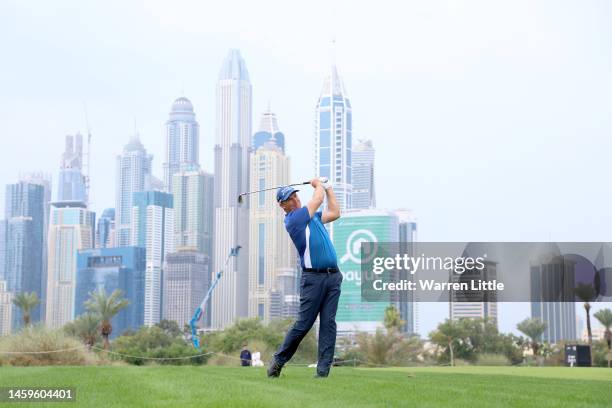 Padraig Harrington of Ireland plays their second shot on the 13th hole during Day One of the Hero Dubai Desert Classic at Emirates Golf Club on...