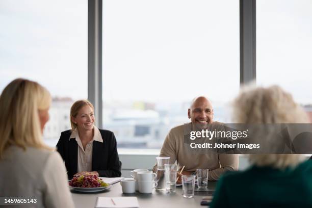 smiling people at business meeting - built space stock pictures, royalty-free photos & images