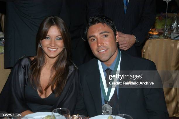 Millie Corretjer and Oscar de la Hoya attend the Eighteenth Annual Great Sports Legends Dinner Hosted By The Buoniconti Fund at the Waldorf Astoria...