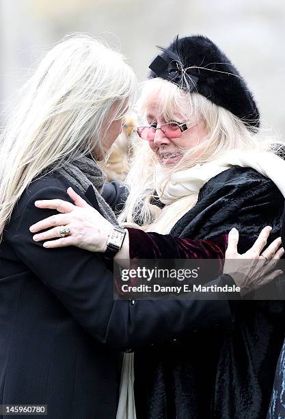 Robin's widow Dwina Murphy Gibb is comforted by a friend at the funeral of Robin Gibb held at St. Mary's Church, Thame on June 8, 2012 in Oxford,...