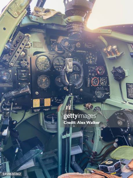 cockpit of supermarine spitfire vintage aircraft at sunset - airshow stock pictures, royalty-free photos & images