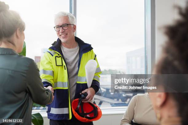 architects having meeting in office - construction worker office people stock-fotos und bilder