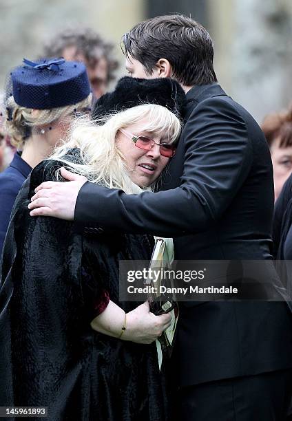 Dwina Murphy Gibb is comforted by her son Robin-John Gibb at the funeral of Robin Gibb held at St. Mary's Church, Thame on June 8, 2012 in Oxford,...