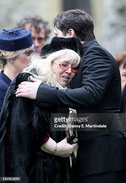 Dwina Murphy Gibb is comforted by her son Robin-John Gibb at the funeral of Robin Gibb held at St. Mary's Church, Thame on June 8, 2012 in Oxford,...