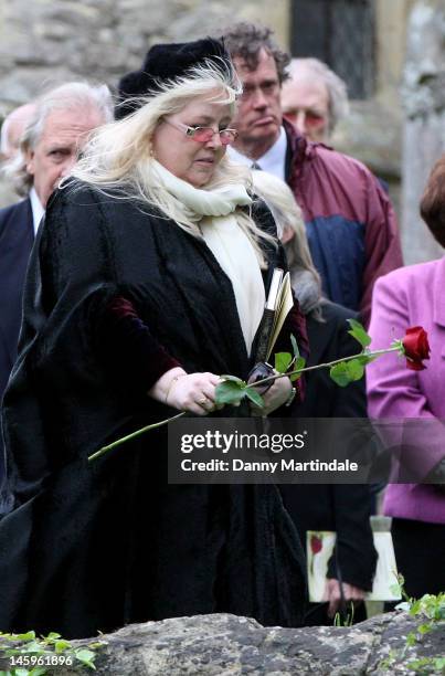Robin's widow Dwina Murphy Gibb places a rose on the coffin at the funeral of Robin Gibb held at St. Mary's Church, Thame on June 8, 2012 in Oxford,...
